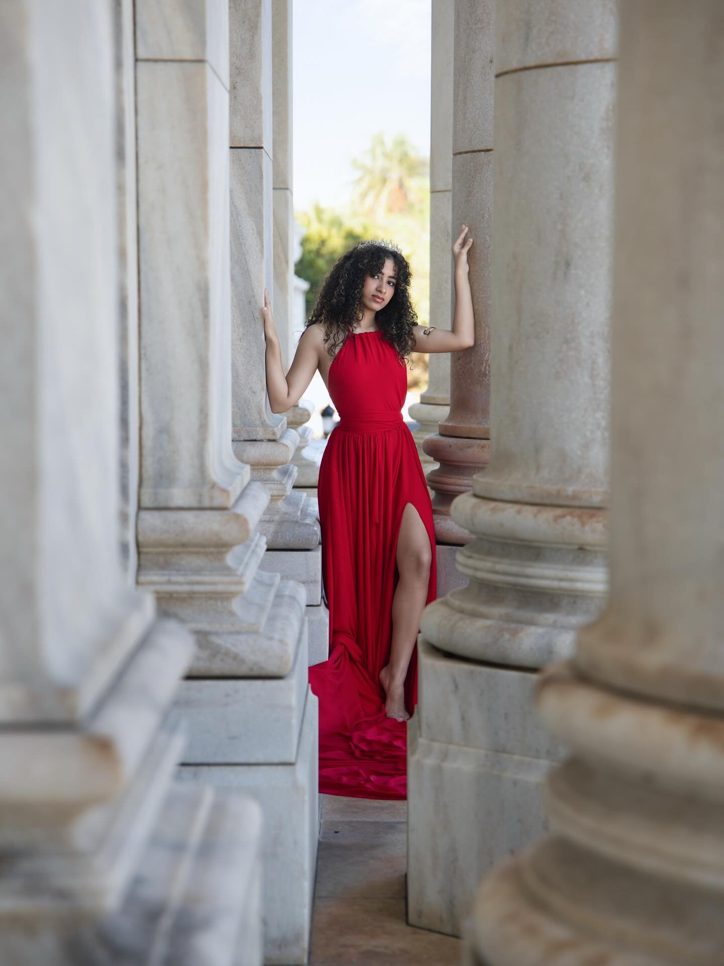 Quinceañera portrait among classical columns